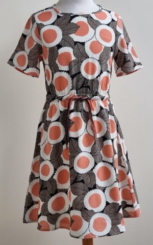 Fred & Ginger roomwit jurkje met bruine/oranje prints mt. 140