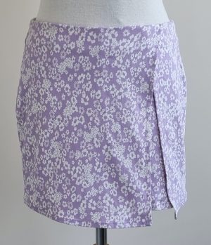 Primark stretchy lila broek/rokje met bloemetjes mt. 36
