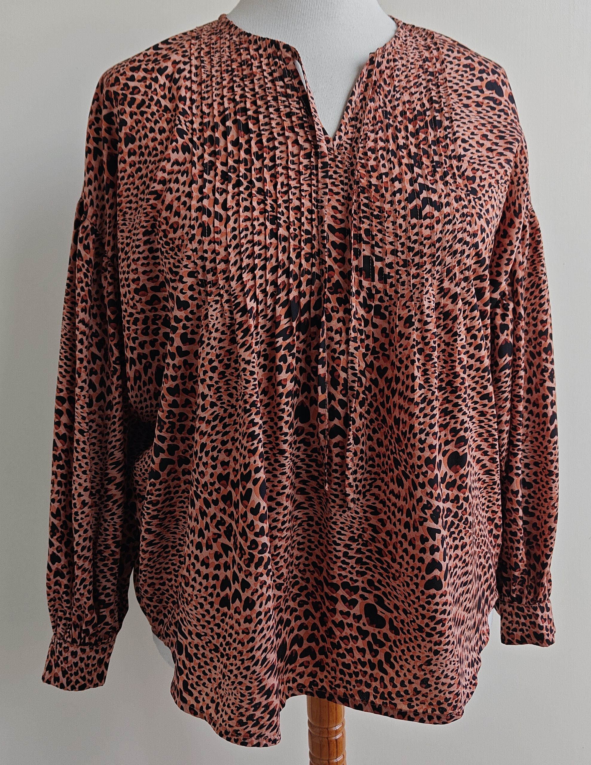 Norah oranje wijdvallende blouse met print. mt. 38